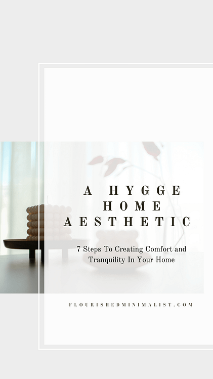 hygge table decor of candles and a flower vase